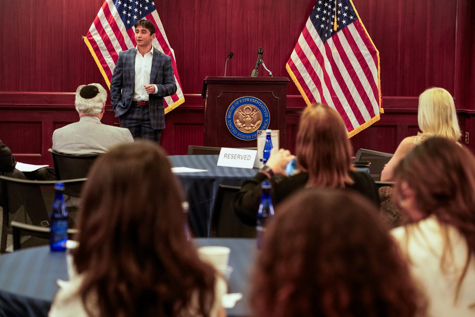 Sam Salz addressing an audience at the U.S. House of Representatives.
