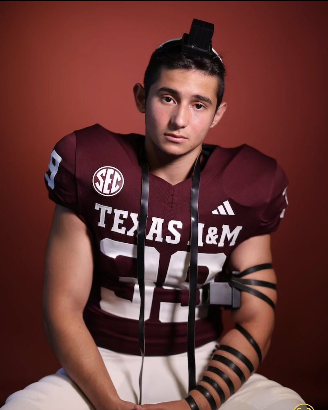 Sam Salz in his Texas A&M number 39 uniform wearing tefillin.